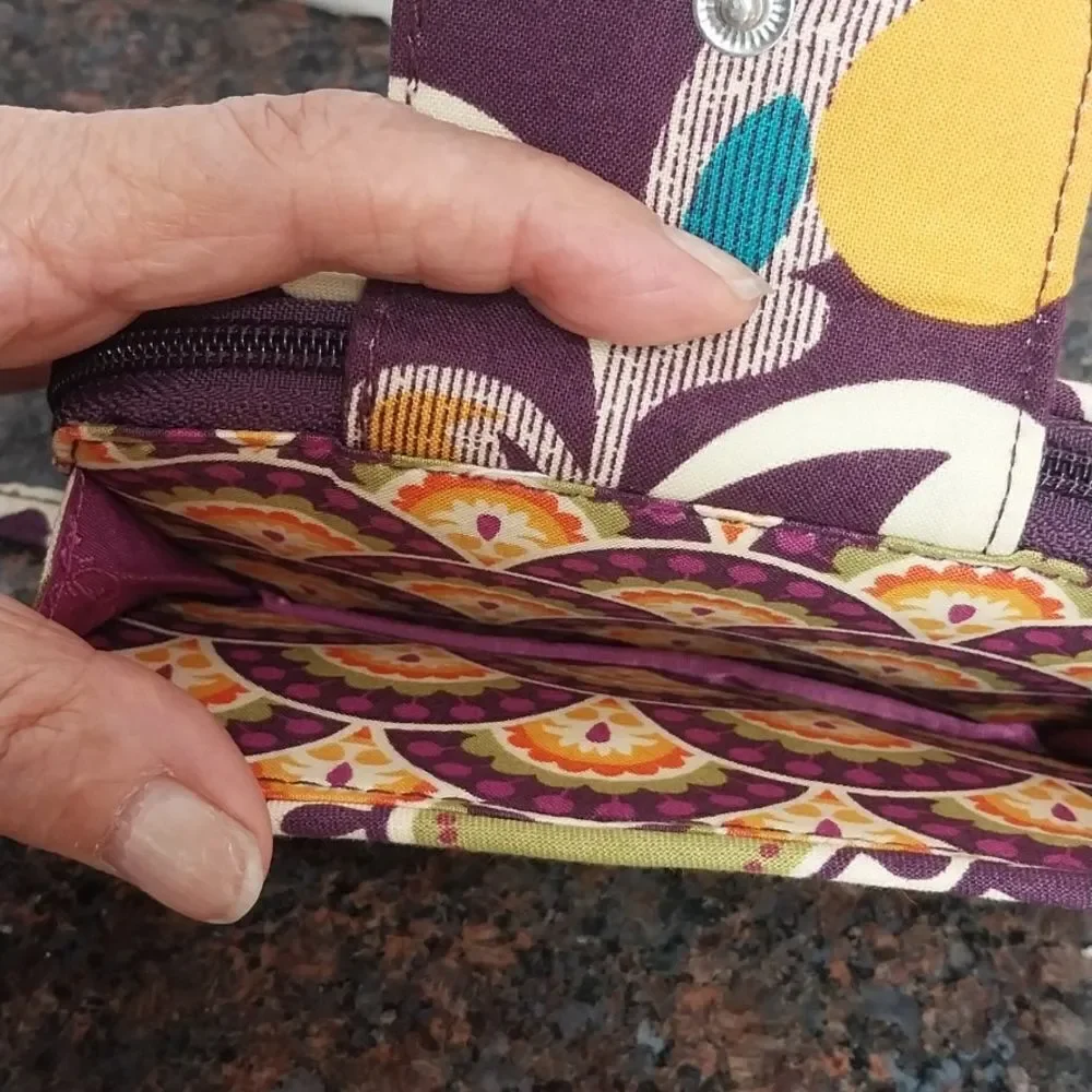 Vera Bradley  Cosmetic Case  and Wristlet.  They are both excellent condition.